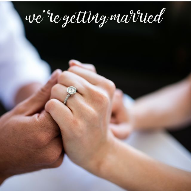 This image portrays the hands of a Caucasian couple with an engagement ring, symbolizing the announcement of their marriage. Ideal for use in wedding invitations, engagement announcements, and romantic-themed blog posts.