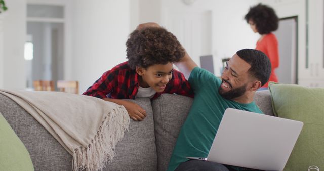 Father and Son Bonding with Laptop on Sofa at Home - Download Free Stock Images Pikwizard.com