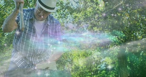 Man in hat chopping wood amidst fantasy galaxy forest scene