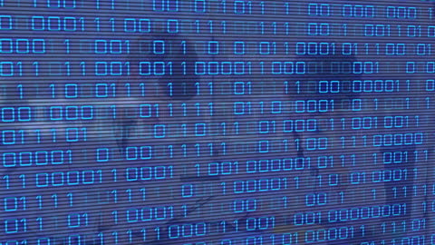 Binary Code Overlaying DNA and Blurred Laboratory Scene