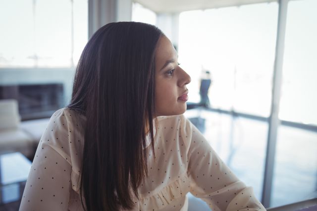 Close up of thoughtful businesswoman looking away in office