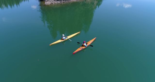 Aerial View of Two People Kayaking on Calm Lake - Download Free Stock Images Pikwizard.com