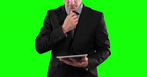 Business Professional Using Tablet on Green Screen Background
