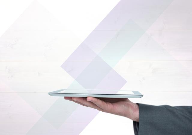 Hand is holding a sleek tablet, with a clean and minimalistic background that features subtle geometric overlays. Ideal for use in business presentations, technology advertisements, promotional materials, or as a visual element to represent innovation and modern technology.