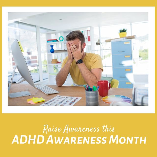 Man sitting at office desk covering face highlighting stress linked to ADHD Awareness Month. Use for campaigns about mental health support, strategies for dealing with workplace stress, and ADHD awareness events.