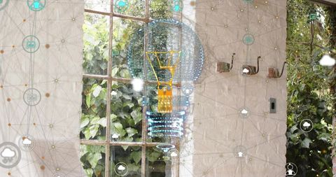 Holographic lightbulb projecting over sunroom window with cloud network overlay and greenery