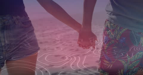 Caucasian Couple Holding Hands on Beach with Digital Overlay