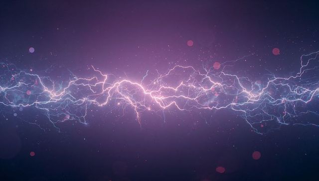 Vibrant electric arc with luminous particles on dark background