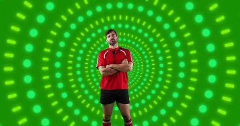 Confident football player stands against digital backdrop