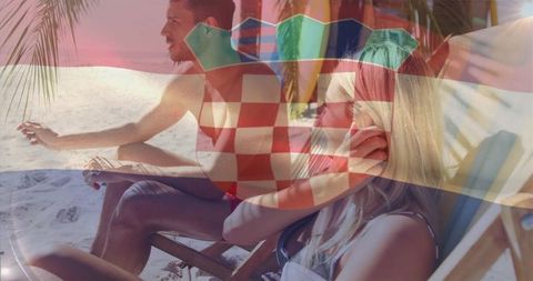 Couple relaxing on tropical beach with croatia flag overlay for travel and vacation