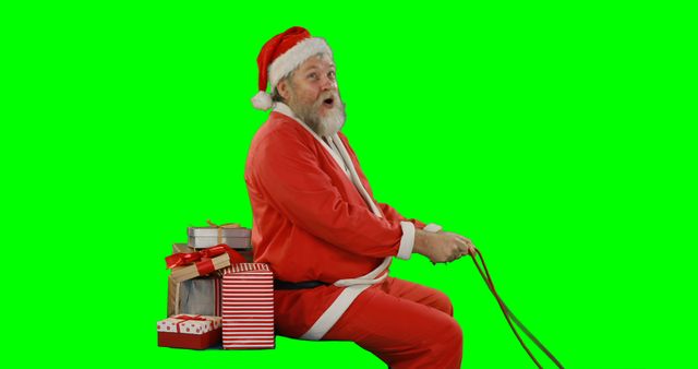 Santa Claus riding a holiday sleigh pulled by reins with a stack of wrapped gifts on a green screen background. Perfect for creating holiday-themed advertisements, festive promos, Christmas cards, or playful holiday social media posts. Easily customizable for various creative projects.