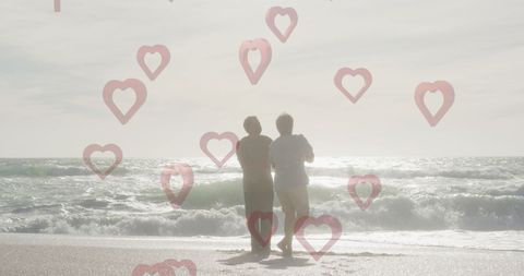 Romantic Couple Dancing on Beach with Heart Overlay