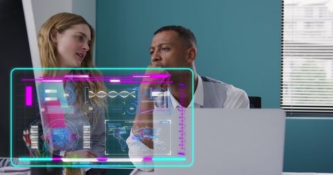 Diverse business professionals analyzing data interface in modern office
