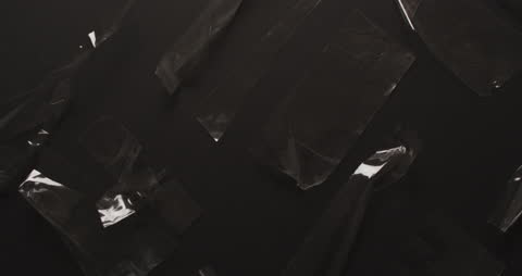 Abstract Close-Up of Transparency Tape on Dark Background