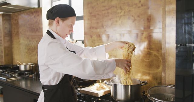 Professional Chef Preparing Pasta in Commercial Kitchen - Download Free Stock Images Pikwizard.com