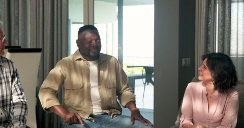Diverse group engaging in insightful therapy session indoors