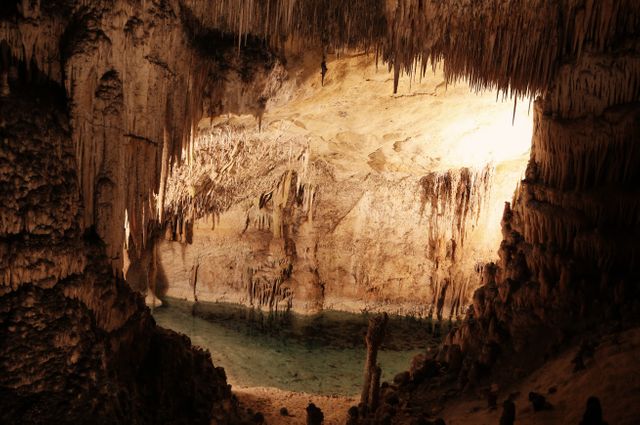 Intricate Stalactites and Rock Formations inside a Cave at Sunset - Download Free Stock Photos Pikwizard.com