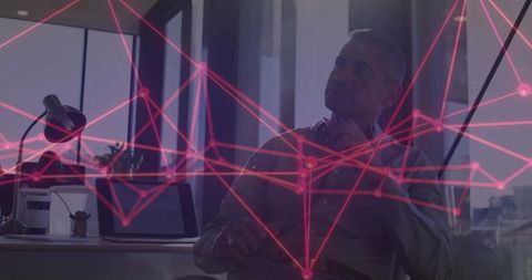 Professional Analyzing Data Analytics at Office Desk