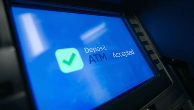 Atm deposit confirmation screen with green checkmark