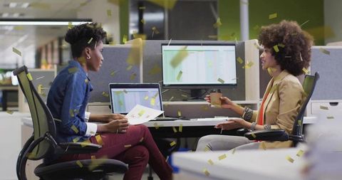 Diverse Professional Women Collaborating in Modern Office Celebration