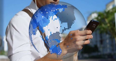 Businessman connected globally via smartphone technology outdoors