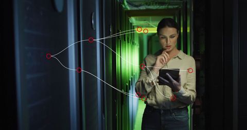 IT Technician Analyzing Data Flow in Server Room