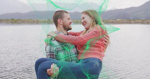 Couple Embracing by Lake Amid Serene Mountain Backdrop