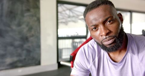 Focused African American Man Exercising in Gym Environment