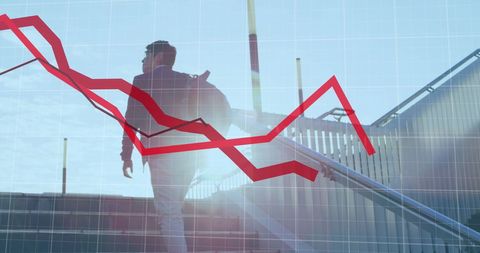 businessman climbing stairs amidst declining graph symbolizing financial challenges - Download Free Stock Images Pikwizard.com