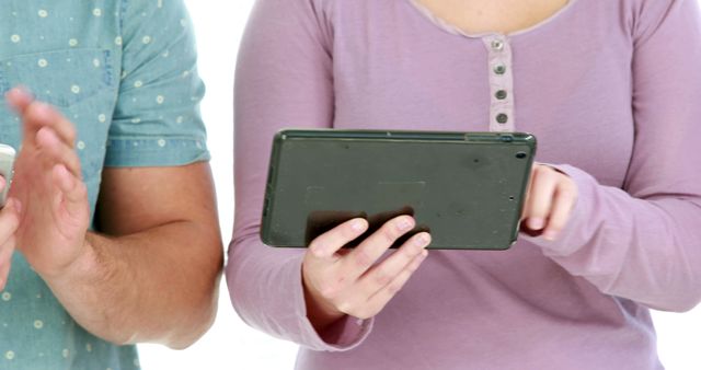 Close-up of Two People Using Digital Devices Together - Download Free Stock Images Pikwizard.com