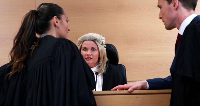 Focused Judge Listening to Lawyers in Courtroom - Download Free Stock Images Pikwizard.com