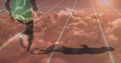 Dynamic Athlete with Prosthetic Blade on Running Track at Sunrise