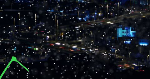 Night city traffic with digital data overlay