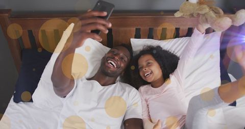 Happy Father and Daughter Taking Selfie Together