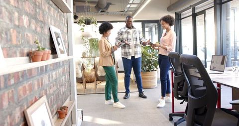Diverse team collaboration in modern office with casual attire
