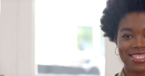 Smiling African American Woman Posing Naturally Inside Cozy Home