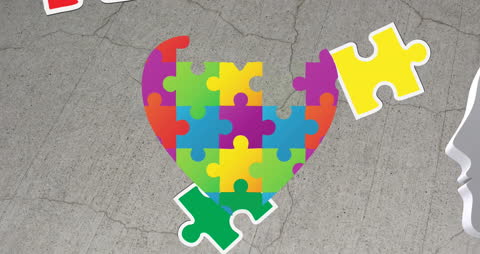 Colorful Puzzle Heart on Concrete Background Symbolizing Autism Awareness