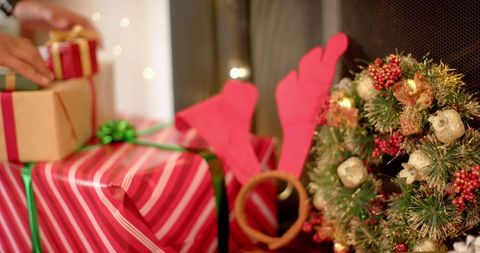 Festive Gift Wrapping in Cozy Holiday Atmosphere - Download Free Stock Images Pikwizard.com