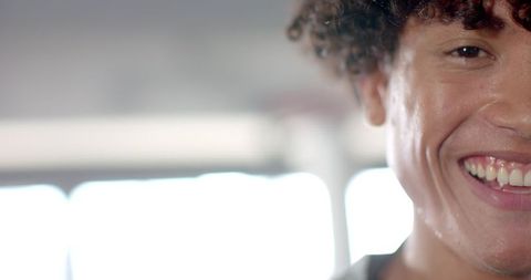 Smiling Young Man Portrait in Gym Lit by Warm Window Light