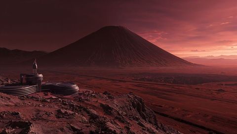Futuristic martian volcano outpost overlooking red desert research habitat at sunset