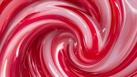Swirling glossy red white pearlescent vortex macro background with iridescent ribbons