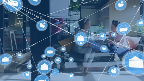 Digital Network Overlay on Office Discussion of Two Women