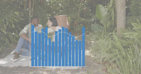 Couple enjoying garden picnic holding white bouquet among tropical plants with blue data overlay
