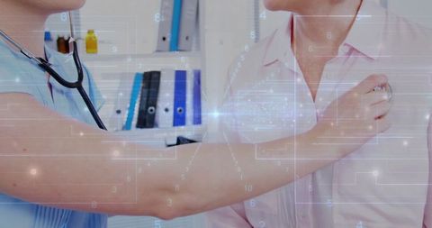 Nurse conducting chest examination using stethoscope at clinic