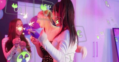Young Women Celebrating with Sparklers and Neon AR Icons in Vibrant Indoor Party