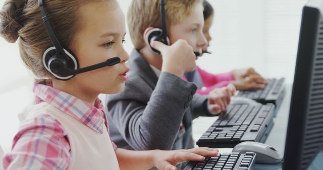 Young Children Working with Headsets in Office - Download Free Stock Images Pikwizard.com