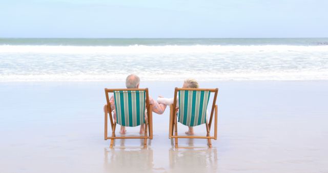 Elderly Couple Relaxing on Beach Chairs by Ocean - Download Free Stock Images Pikwizard.com