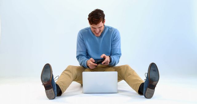 Man Playing Video Game on Laptop, Having Fun - Download Free Stock Images Pikwizard.com