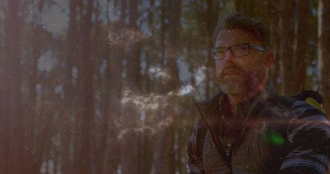 Contemplative Male Hiker in Enchanted Forest
