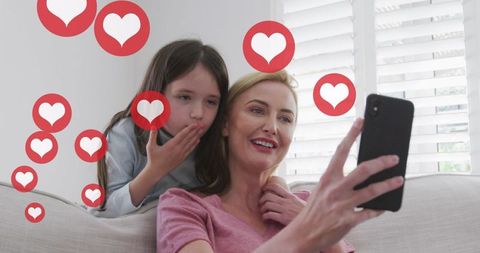 Mother and Daughter Engaged in Social Media Activity